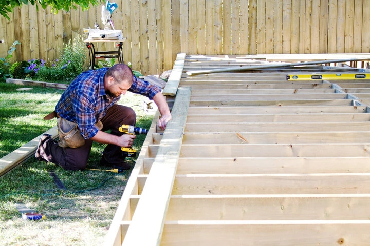 Professional crew installing a custom backyard deck in a Allentown residential property