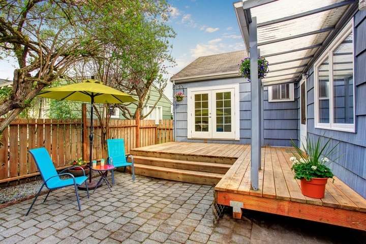 Experienced Allentown custom deck builders discussing outdoor deck plans with homeowners